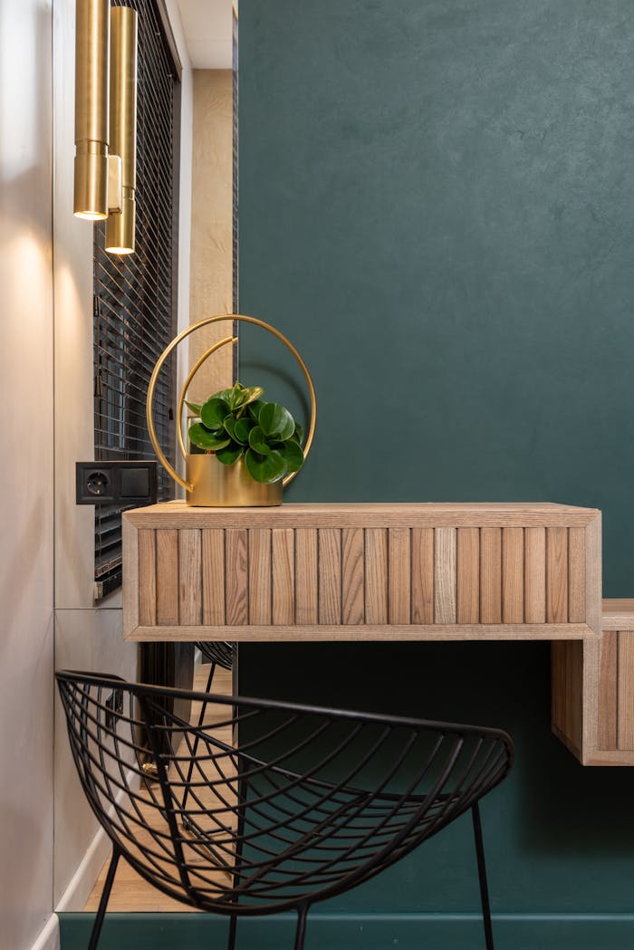 services-02 Stylish modern interior design featuring a chic green wall, wooden vanity, and a sleek black chair.